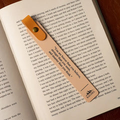 Bookmark with motivational quote on an open book