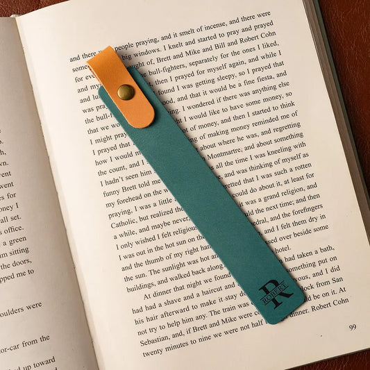 Teal and orange bookmark on an open book