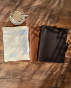 Legacy Binder A4 leather cover displayed beside removable pages and photography props