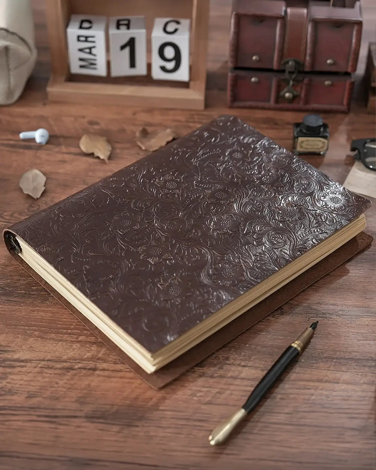 Espresso Legacy Floral A5 leather ring-binder journal in a writing setting
