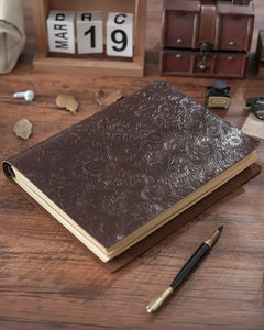 Espresso Legacy Floral leather ring-binder journal on a writing desk