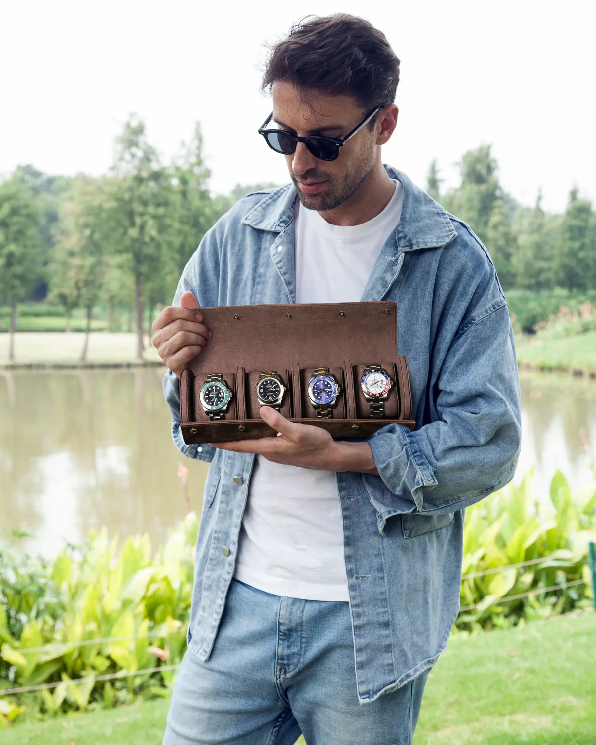 Espresso four-watch roll held open outdoors, showing four watches arranged in one row.