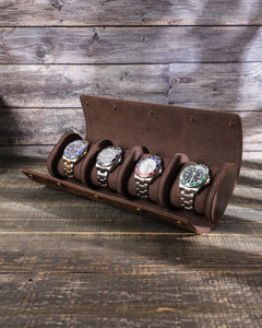 Side view of the open four-watch roll, showing its cushions, interior dividers and snap fasteners.