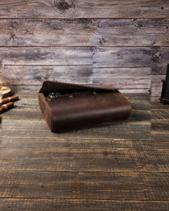 Espresso six-watch case with the curved flap partially open on a wooden tabletop.