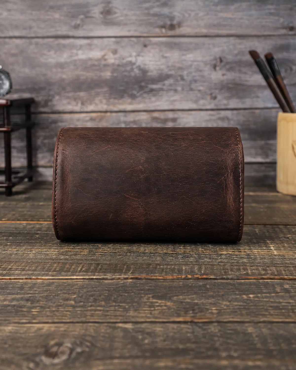 Back view of the Espresso double watch roll, showing the curved leather body and stitched edges.