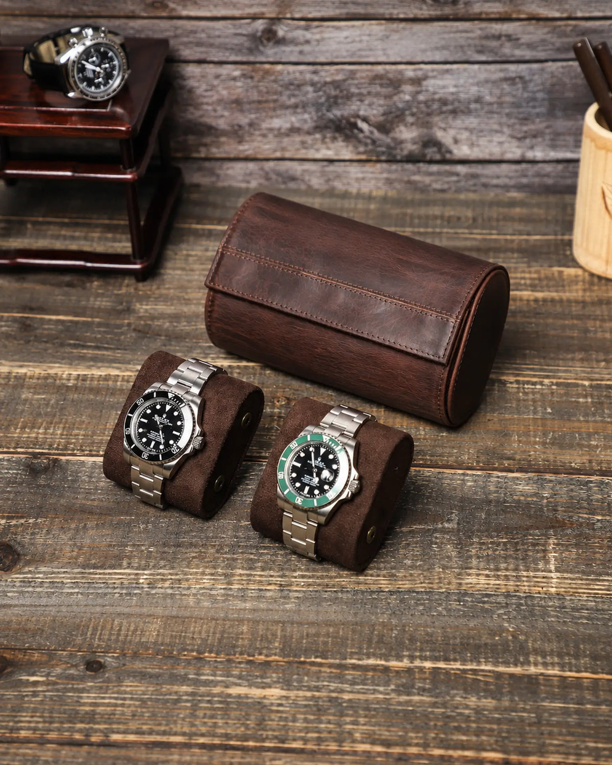 Two removable watch cushions displayed in front of the closed Espresso double watch roll.