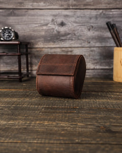 Front view of the closed Espresso watch roll, showing the curved flap and stitched leather exterior.