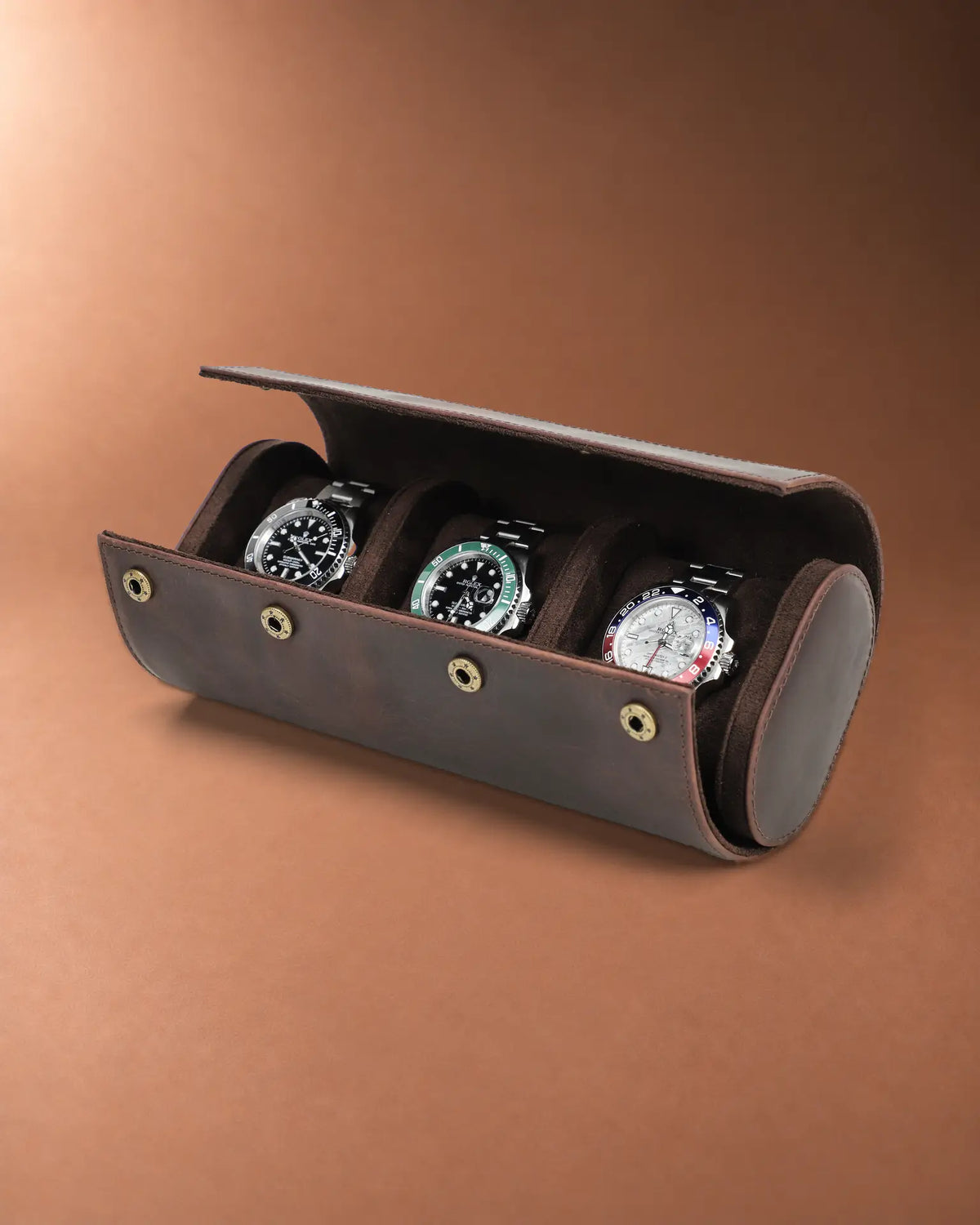 Open Legacy Hidden Snap Triple Watch Roll in Espresso with three watches in separate compartments.