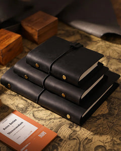 Black Legacy Loop journals shown in several sizes for comparison; one A5 journal sold
