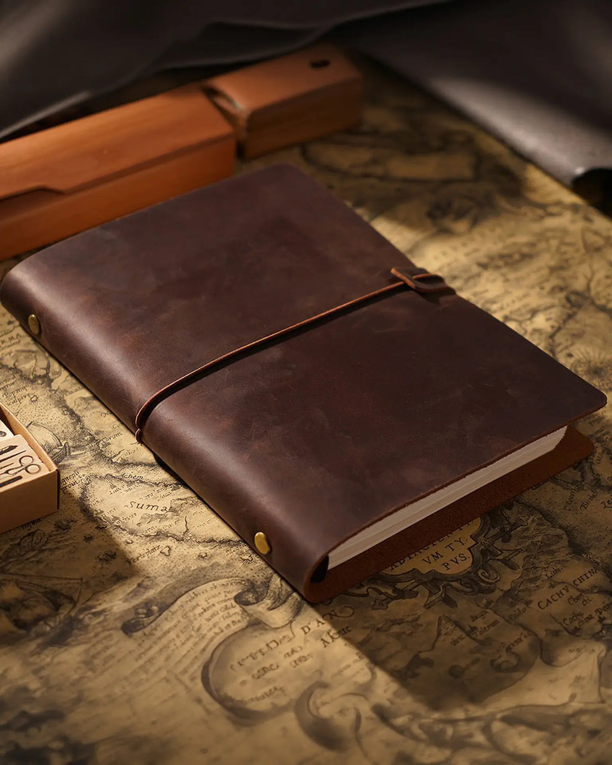 Cognac Legacy Loop A5 journal closed on a writing desk