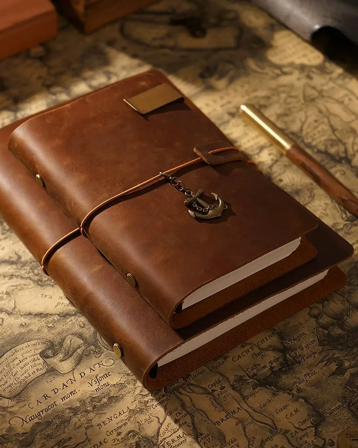 Cognac Legacy Loop journals shown in several sizes for comparison
