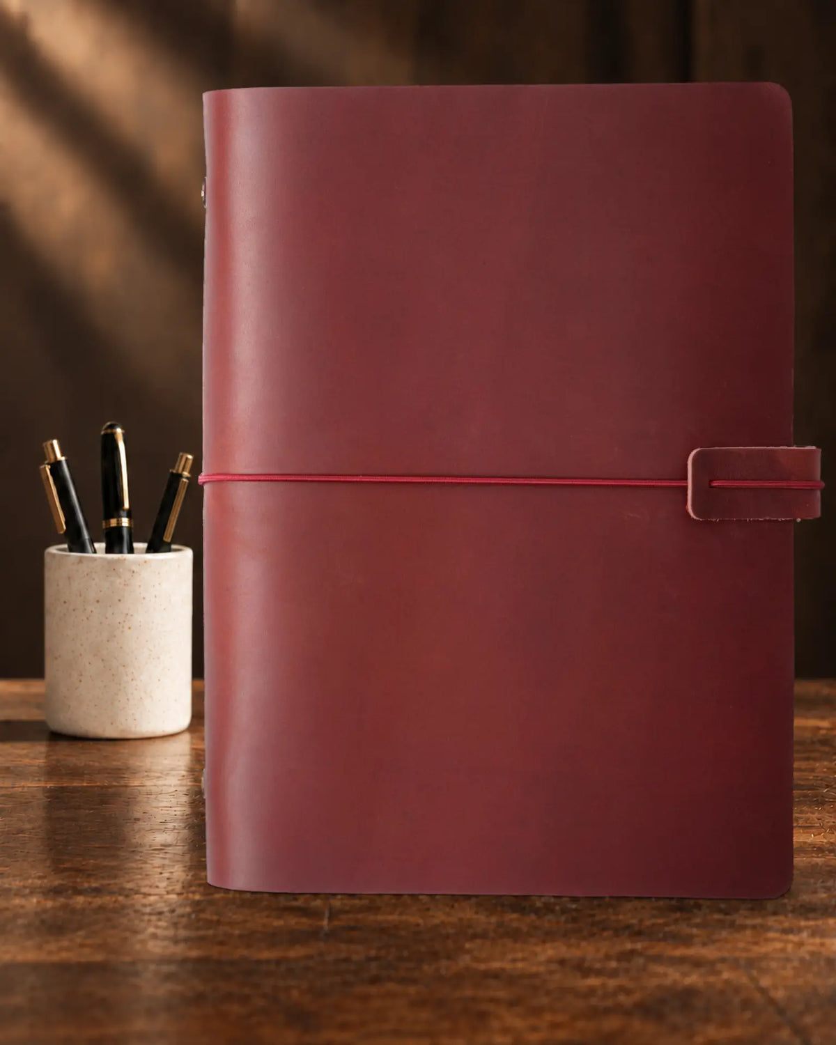 Crimson Legacy Loop A5 leather ring-binder journal with plain cover and wrap closure