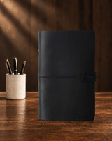 Black Legacy Loop A6 leather ring-binder journal with a plain cover and wrap closure