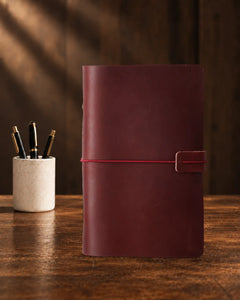 Crimson Legacy Loop A6 leather ring-binder journal with a plain cover and wrap closure