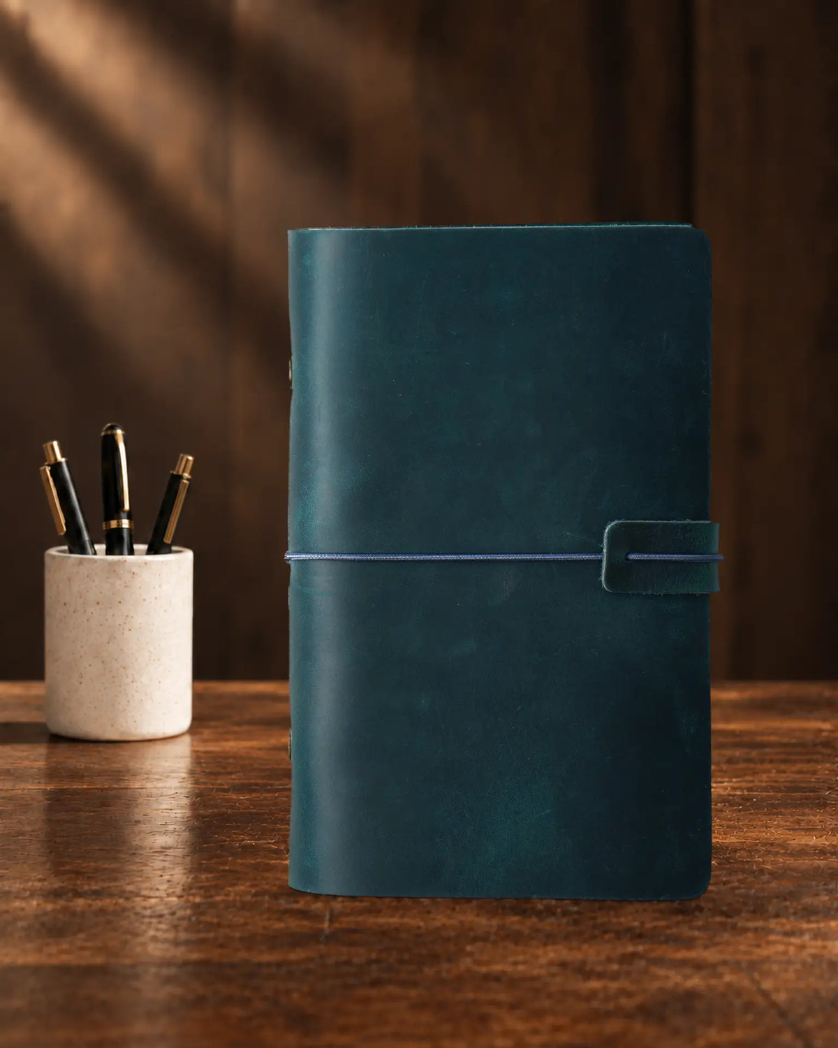 Teal Blue Legacy Loop A6 leather ring-binder journal with a plain cover and wrap closure