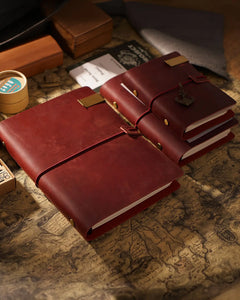 Crimson Legacy Loop journals in several sizes with wrap closures and photography props