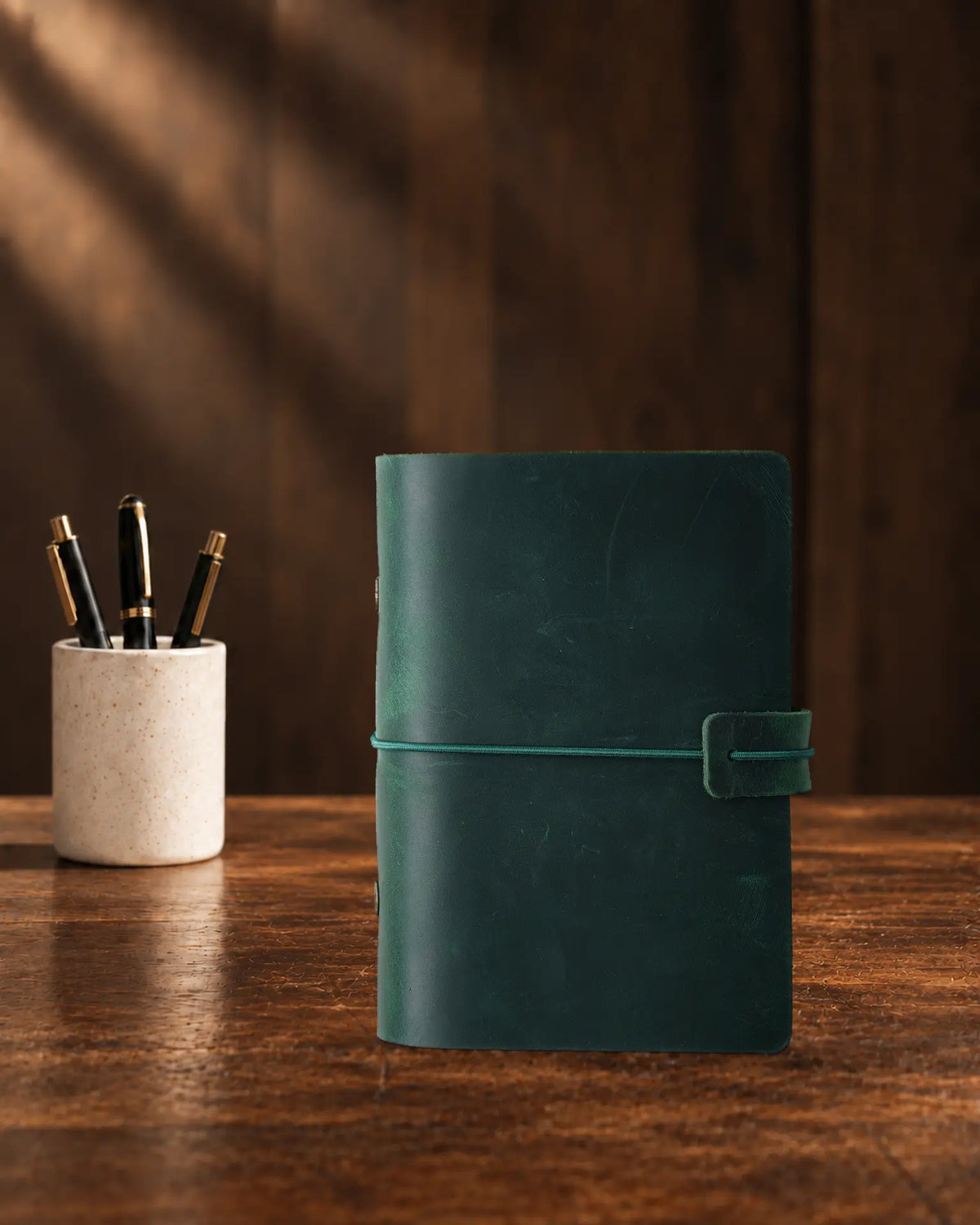 Forest Green Legacy Loop A7 leather ring-binder journal with a plain cover and wrap closure
