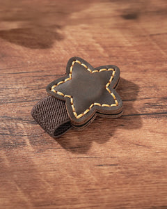 Espresso leather star magnetic bookmark with tan stitching and brown elastic pen loop
