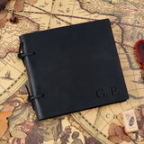 Black loose-leaf leather notebook with strap