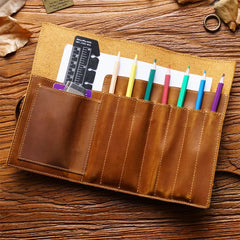 Colored pencils in leather pen roll case