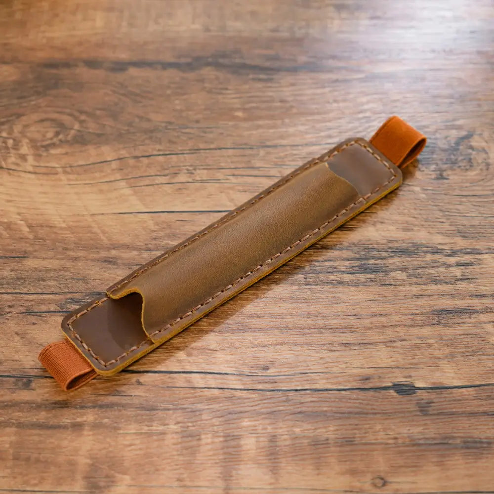 Brown leather pen loop for notebook with elastic band