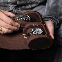 Hand holding 2 watch leather roll showing compact size