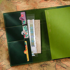 Leather journal open showing 100gsm cream pages