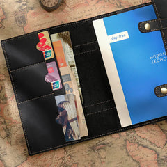 Leather journal open showing 100gsm cream pages