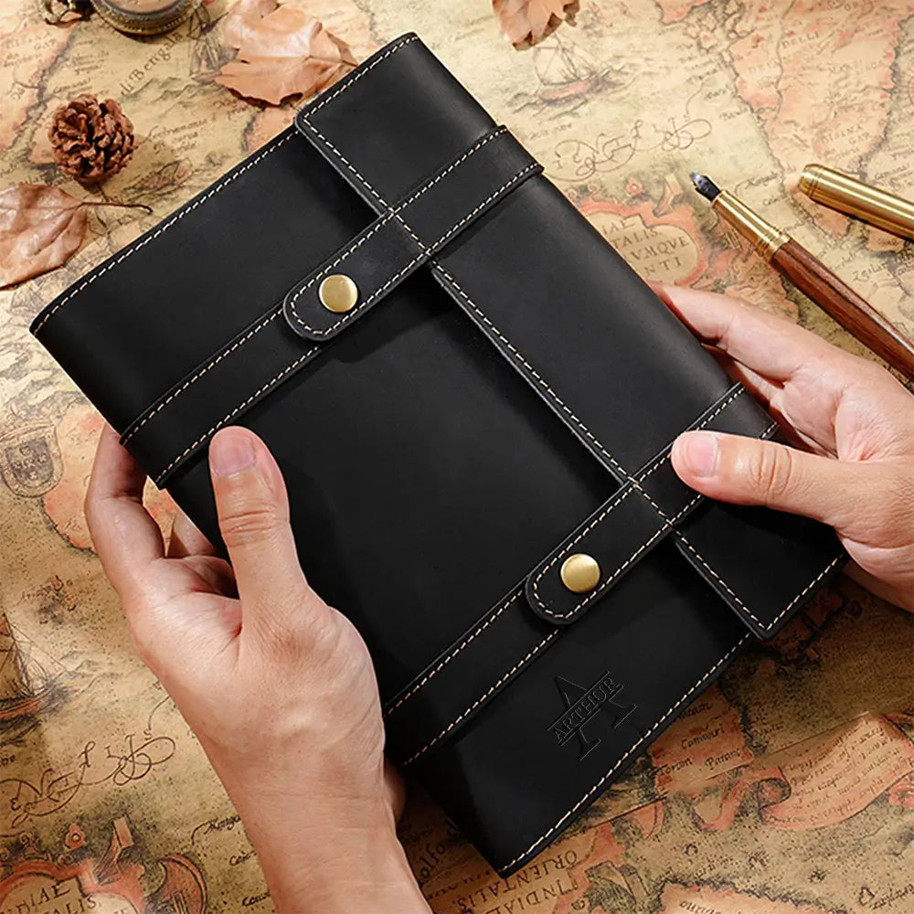 Black vintage leather journal with strap