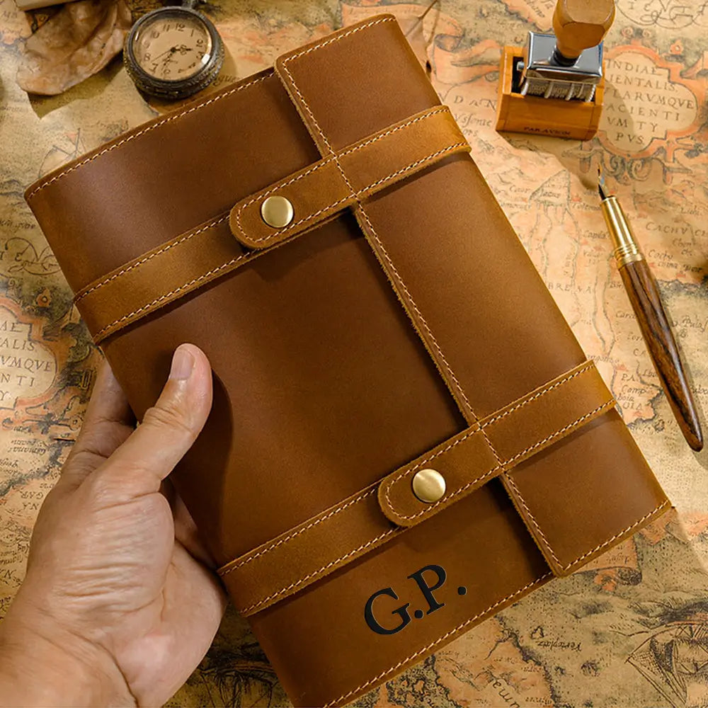 Brown personalized leather notebook with strap closure